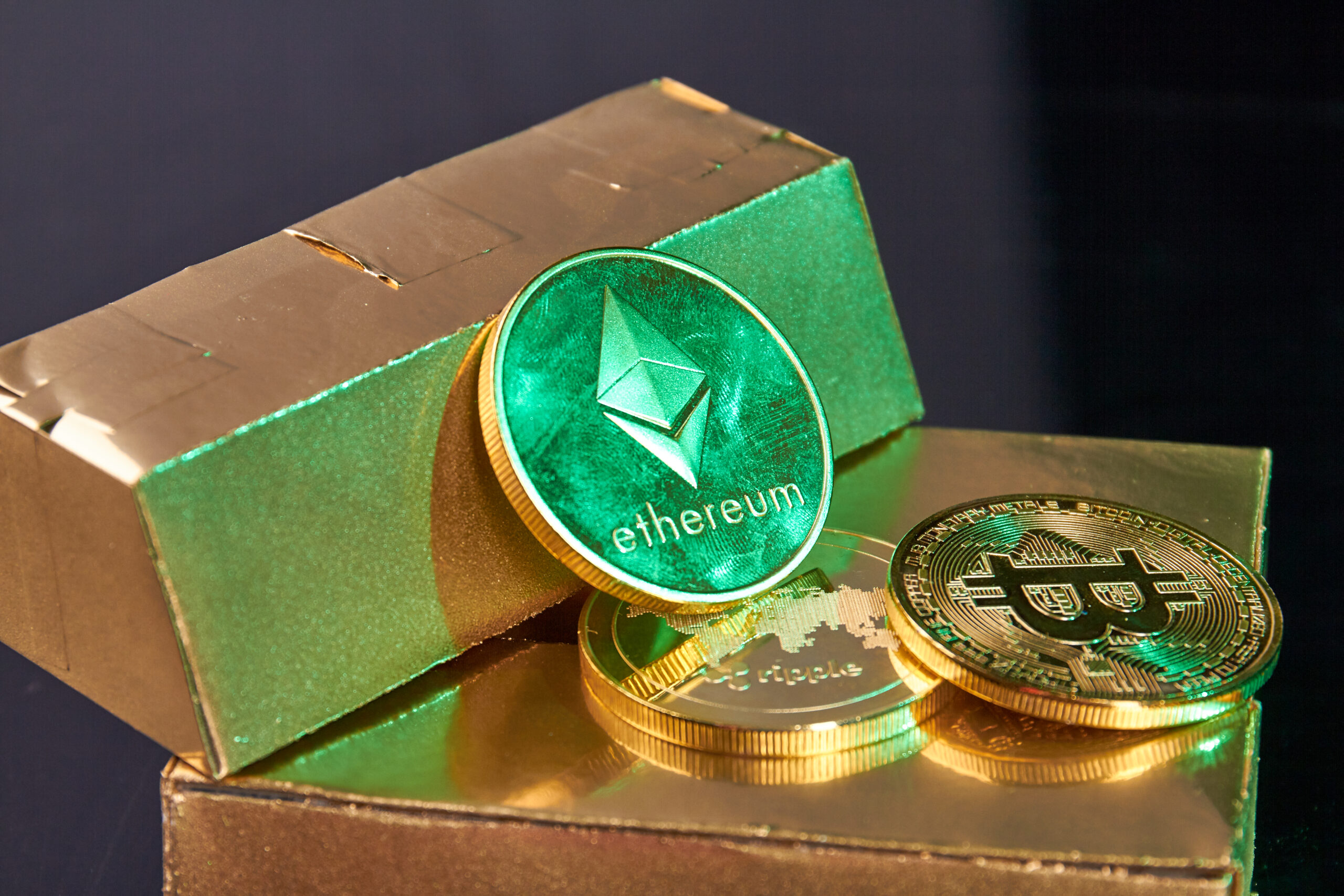 Bunch of golden cryptocurrency coins and ingots close-up. Virtual money investing concept.